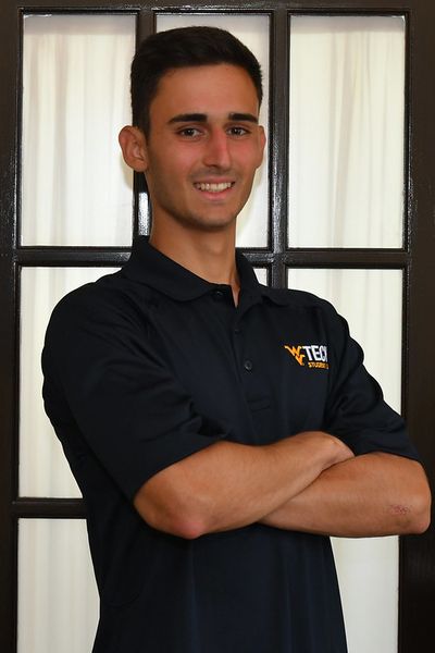 Headshot of Antonio in a blue polo when he was a resident assistant at WVU Tech