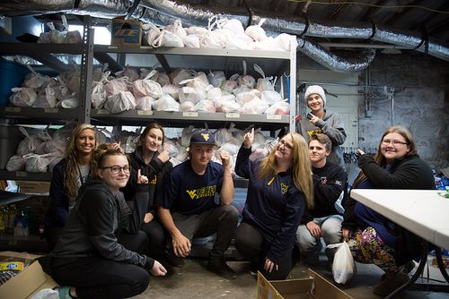WVU Tech volunteers packed snacks for local youngsters for One Voice's Food for Angels project.