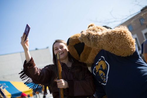 mountain and golden bear taking a selfie