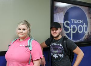 Students wait in line at the Tech Spot during the cafe's grand opening.