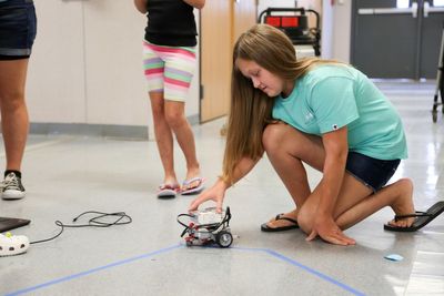 Students in the GIRLS program put their programming skills to the test with LEGO robots.
