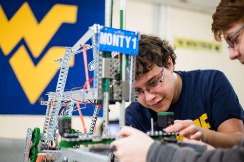 Vex robotics club students work on Monty1.