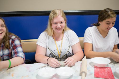 Upward Bound Students make clay bowls for a local food pantry.