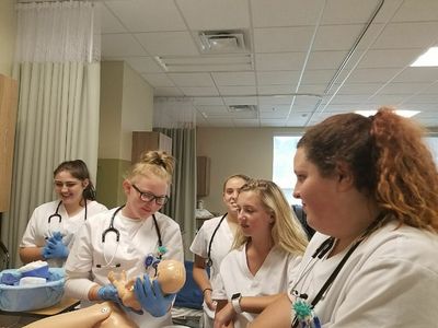 Students work with Bluefied State College nurses to learn about life in the OB.