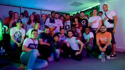 Players gather at BeGame during a FIFA tournament.